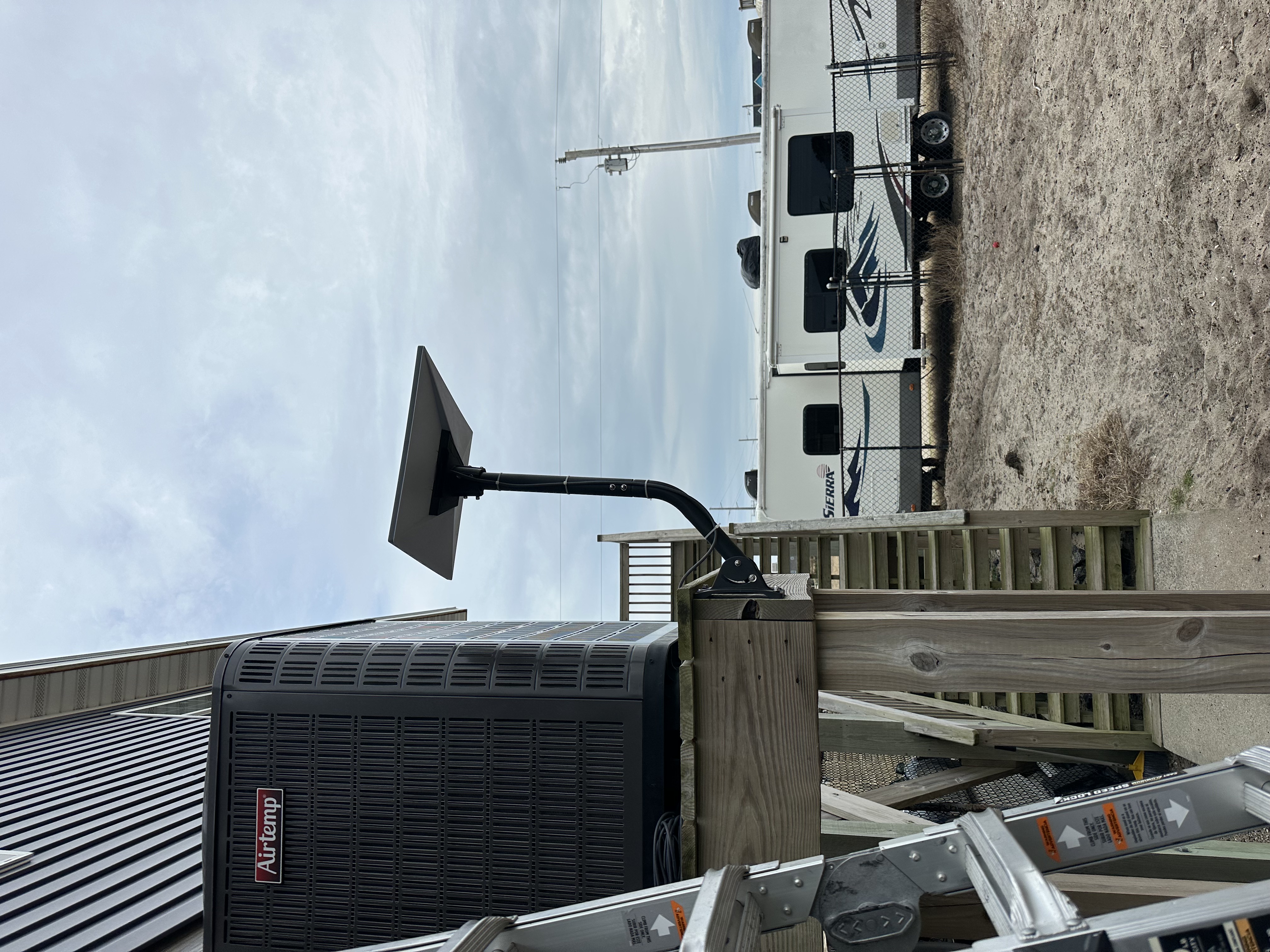 satellite dish pole mount on elevated deck â Outer Banks coastal installation