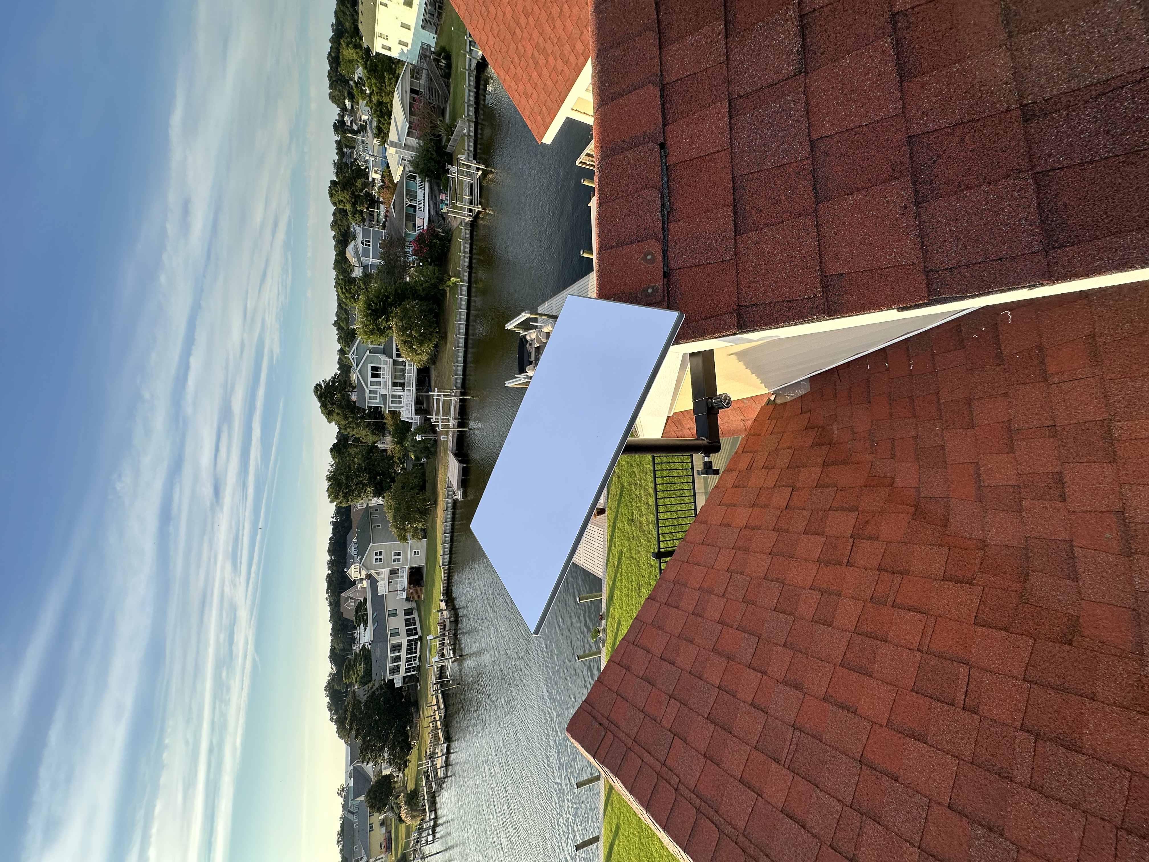 satellite dish rooftop installation with waterfront view â OBXtec professional install